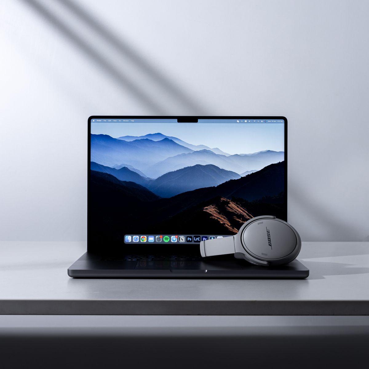 Laptop and headphones on a desk