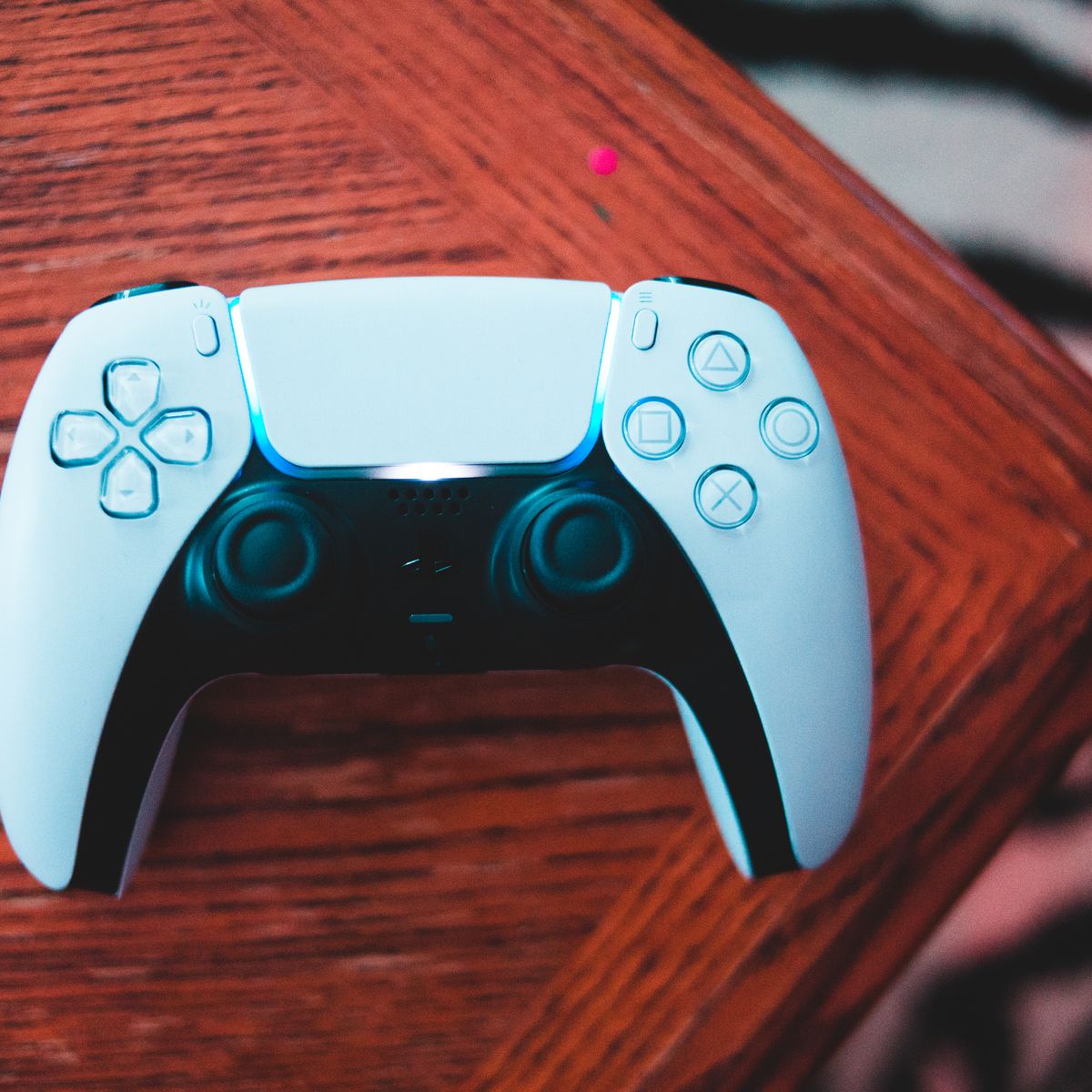 White game controller on a wooden table