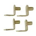 Four brass-plated angled shelf support pins arranged in a square