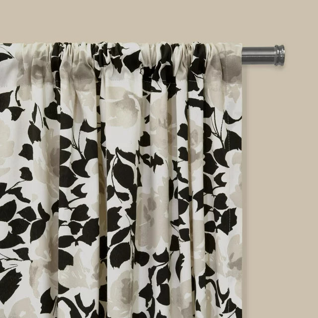 Gathered rod pocket top of the floral panel on a silver rod
