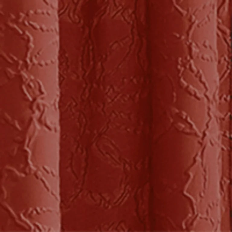 Close-up of the rust red microsculpt floral fabric
