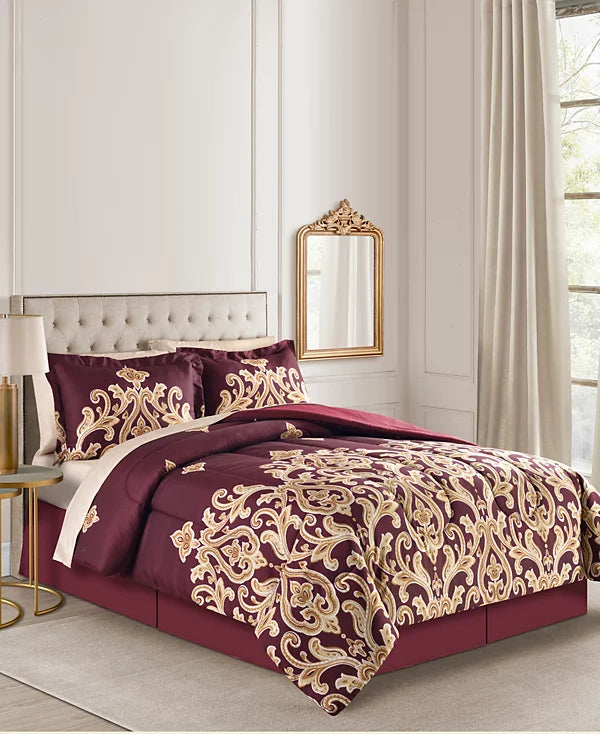 Side view of the burgundy and gold damask comforter set in a bedroom with a gold mirror