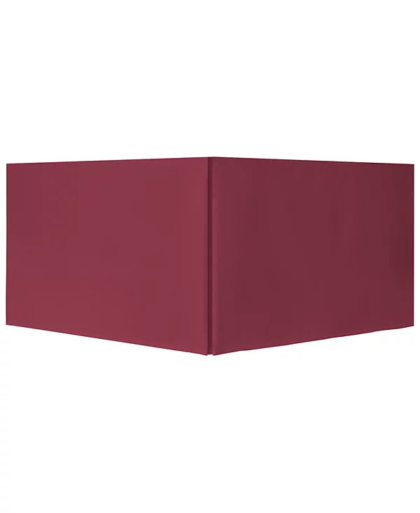 Solid burgundy bed skirt shown on its own against white