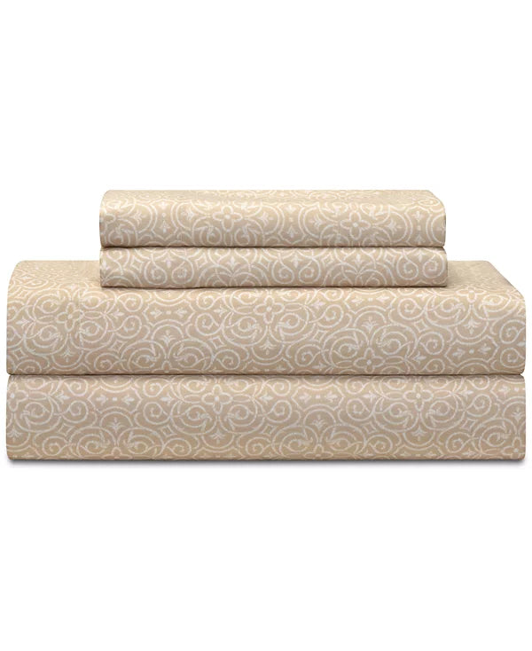 Folded beige sheet set with a white scroll pattern