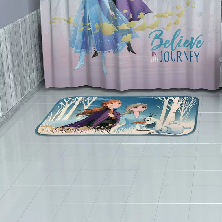 Frozen 2 rug on a tiled bathroom floor below a Believe in the Journey curtain