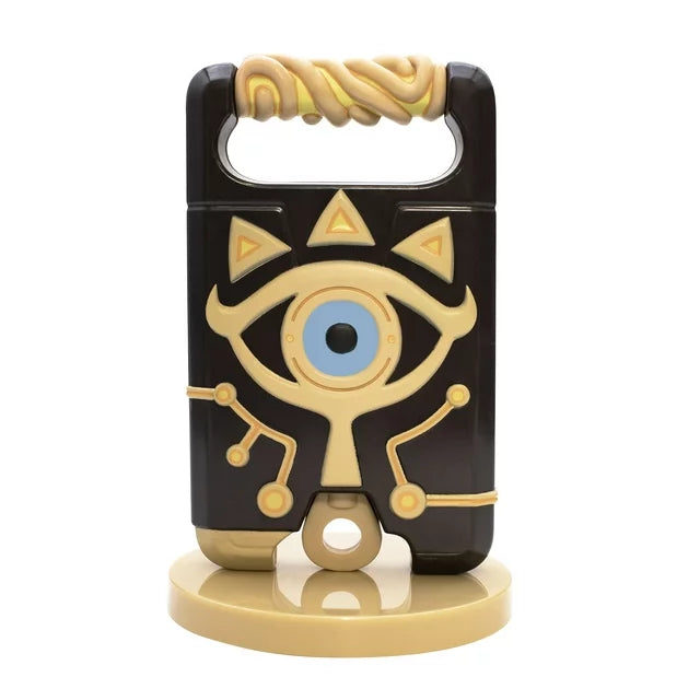 Sheikah Slate eye-design phone stand on a round tan base