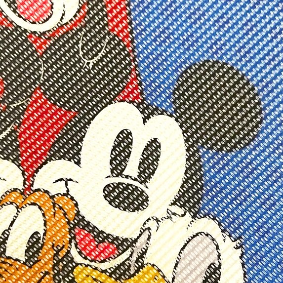 Close-up of the Mickey Mouse print on the hook-and-loop paddle surface