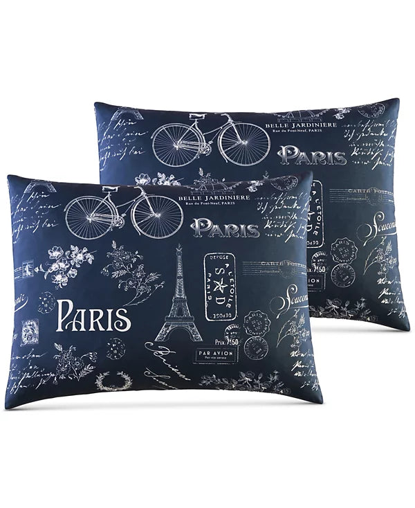 Two navy pillow shams printed with an Eiffel Tower, bicycle and Paris lettering