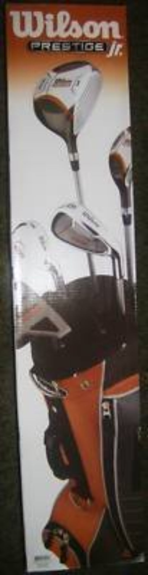 Tall box for a junior golf set showing a driver, irons and orange and black bag