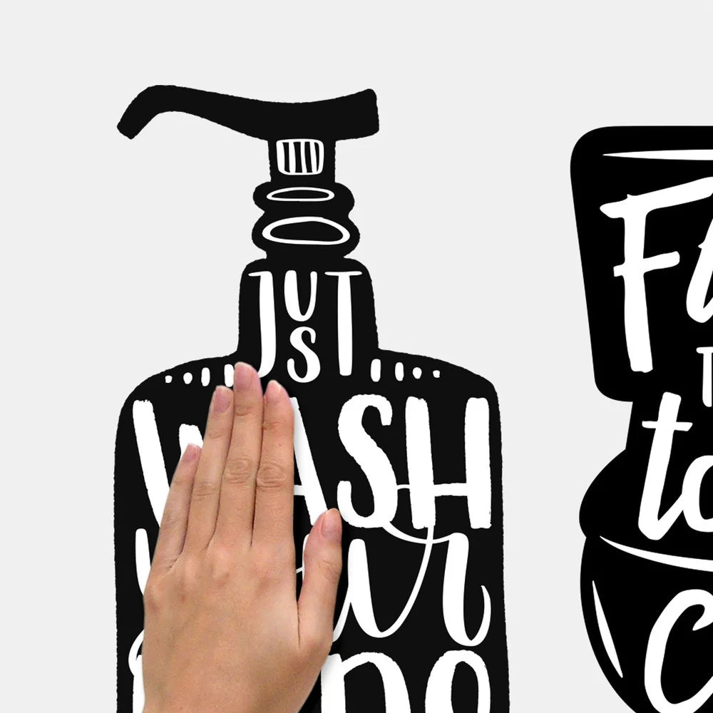 Hand smoothing the soap pump Wash your hands please decal onto a wall