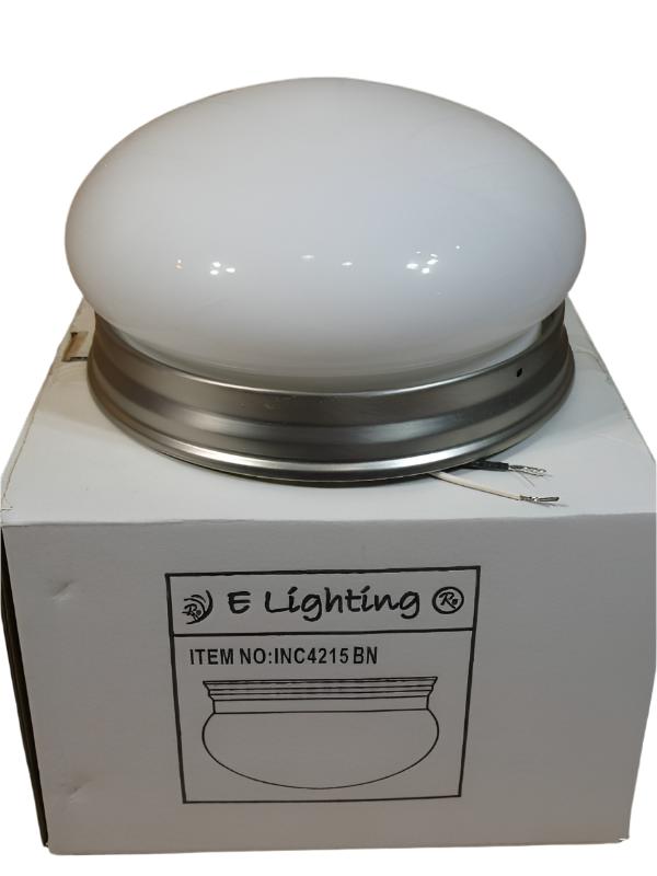 Flush mount ceiling light with white glass dome resting on its retail box