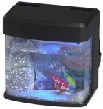 Small lighted desktop fish tank with toy fish and blue glow
