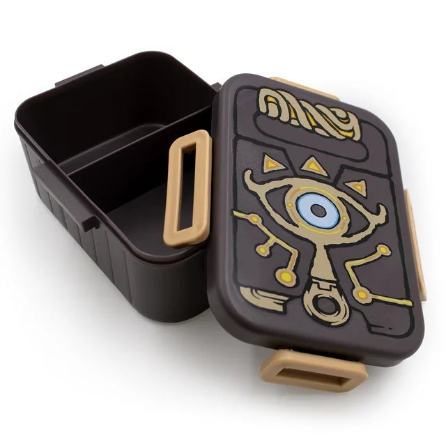 Brown Sheikah Slate bento lunch box with tan clips and divided interior