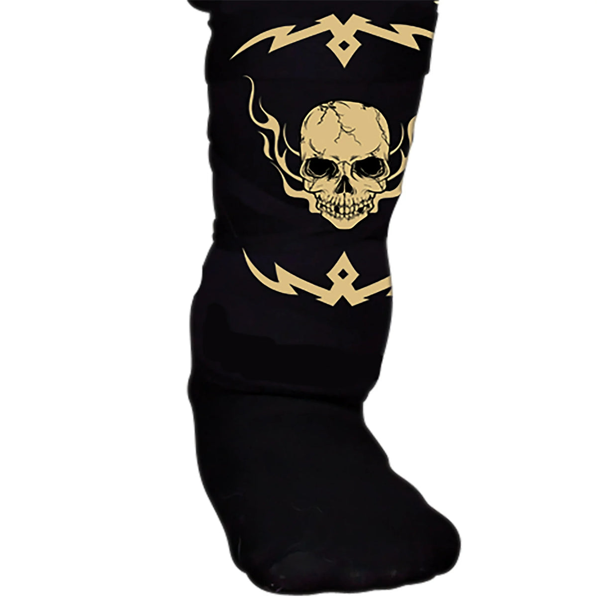 Close-up of a black shin guard with a gold flaming skull and tribal print