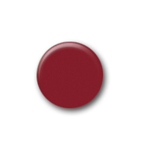 Small round swatch of deep brick red polish