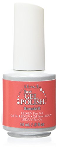 Bottle of coral red LED/UV gel polish with a white cap