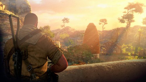 Gameplay scene of the soldier looking over a wall at a sunlit African village