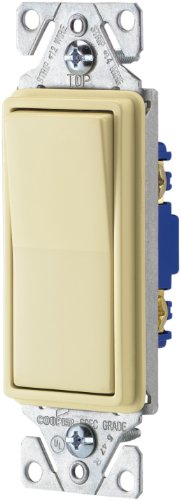 Almond single-pole rocker decorator switch on a white mounting strap
