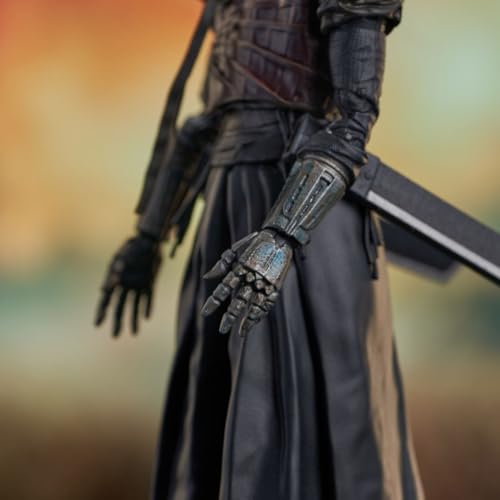 Close-up of the figure's mechanical gauntlet hand and sheathed sword