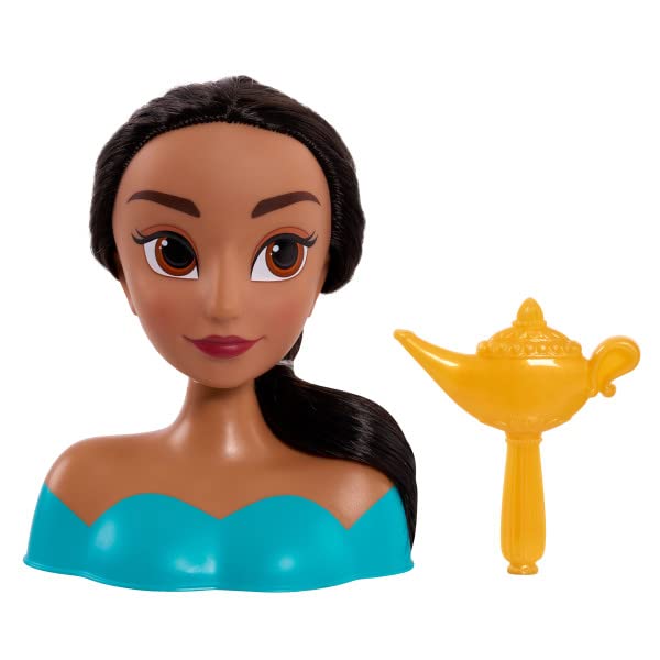 Jasmine styling head in a teal top next to a gold genie lamp shaped brush