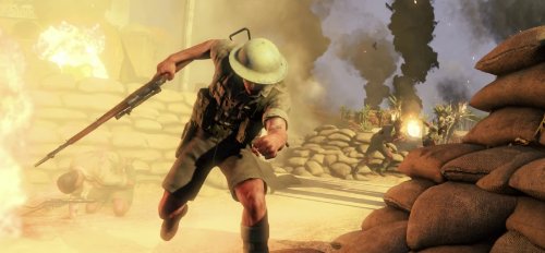 Gameplay scene of a soldier in a pith helmet running through an explosion near sandbags