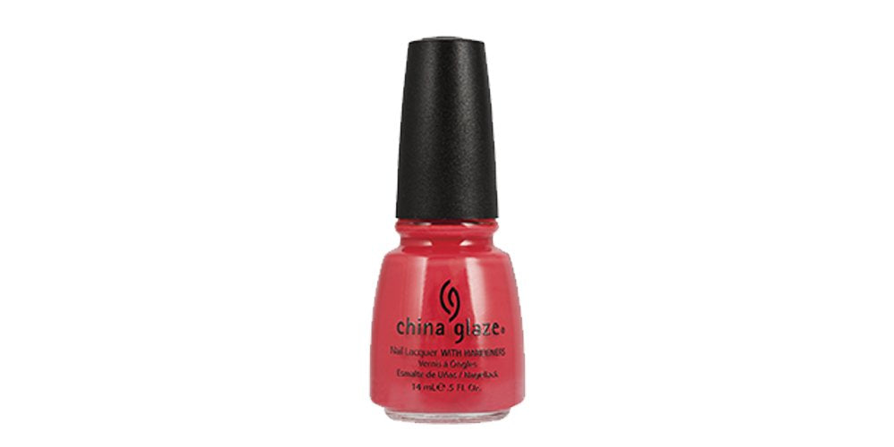 Bottle of coral red creme nail lacquer with a black cap