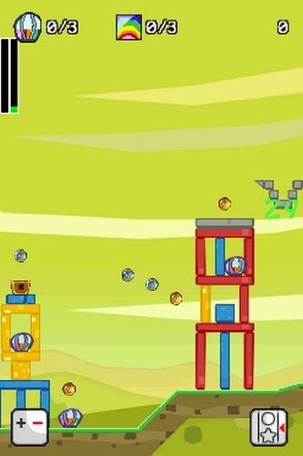 Game screen with red and yellow block towers on a green hill holding striped eggs