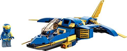 Blue ninja minifigure beside the blue and gold brick jet with swept wings