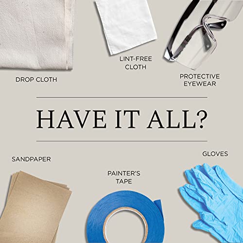 Painting supplies flat lay: drop cloth, cloth, eyewear, sandpaper, painter's tape and gloves