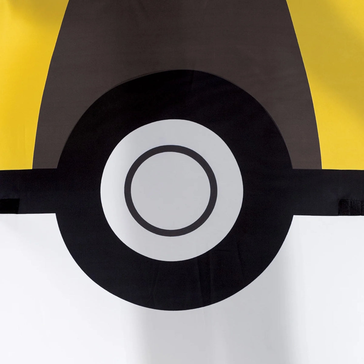 Close-up of the costume's black band and white center button