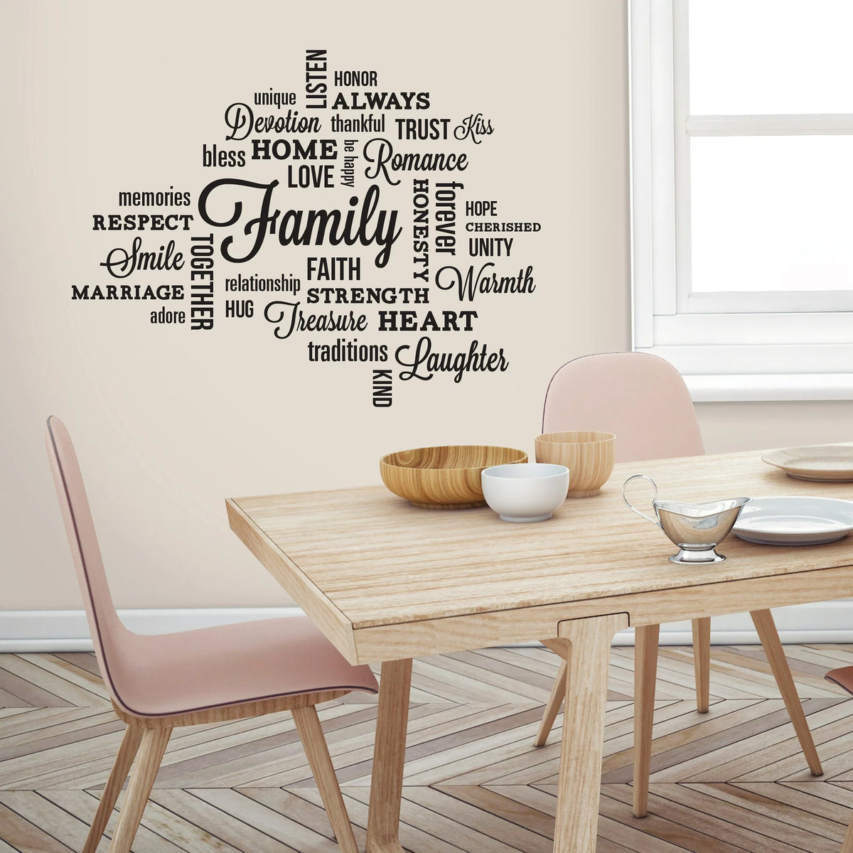 Cloud of black word decals around Family above a light wood dining table