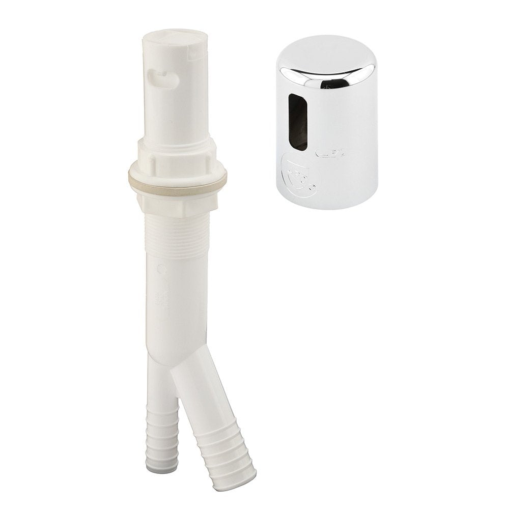 White plastic dishwasher air gap body with Y-shaped hose ports beside its chrome cap