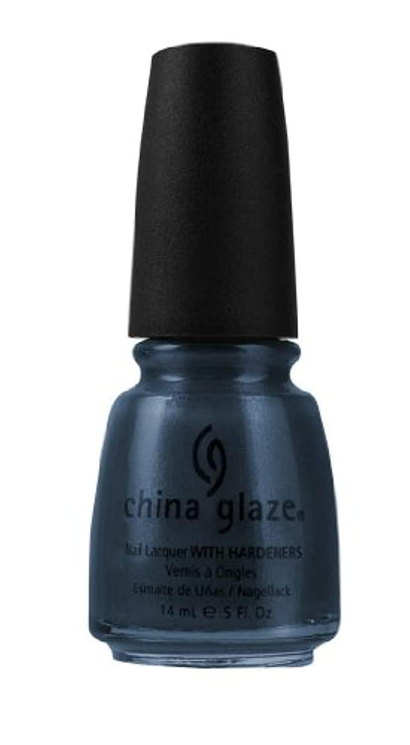 Bottle of deep slate blue shimmer nail lacquer with a black cap