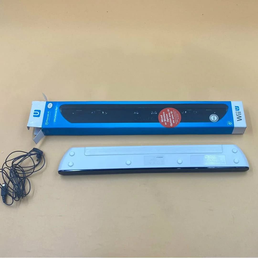 PowerA sensor bar out of its box with its cable on a tan table