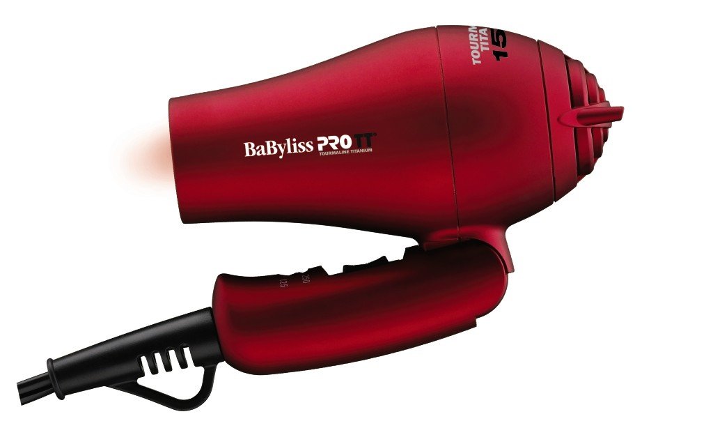 Red travel dryer with its handle folded flat for packing