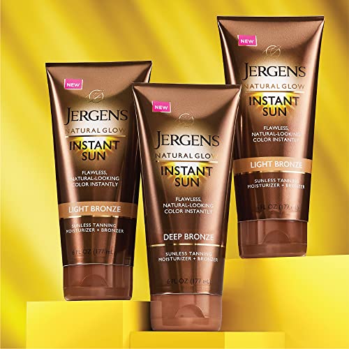 Deep bronze tanning tube between two light bronze tubes on yellow blocks