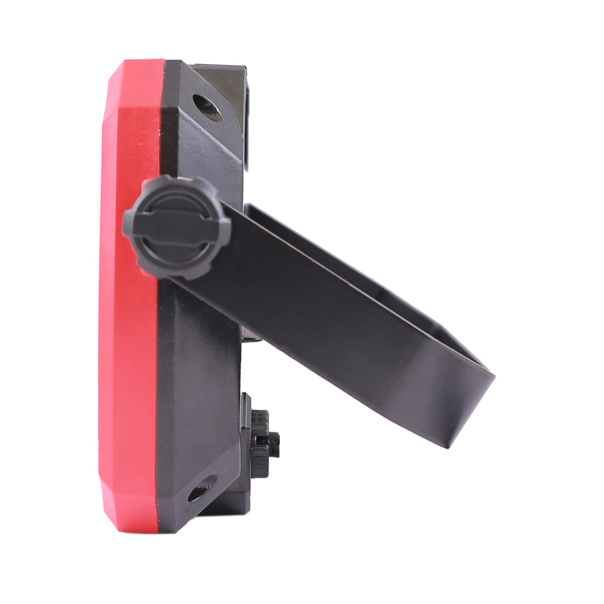 Profile of the red and black work light with its handle swung out as a stand