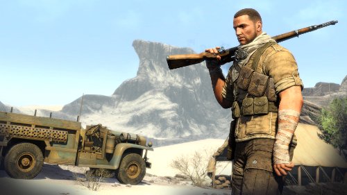 Gameplay scene of the soldier holding a rifle on his shoulder beside an army truck