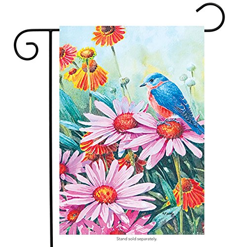 Garden flag with a bluebird perched on pink coneflowers among orange blooms, on a stand
