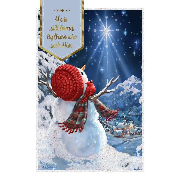 Card art of a snowman in a red hat and plaid scarf looking up at a bright star over a snowy village