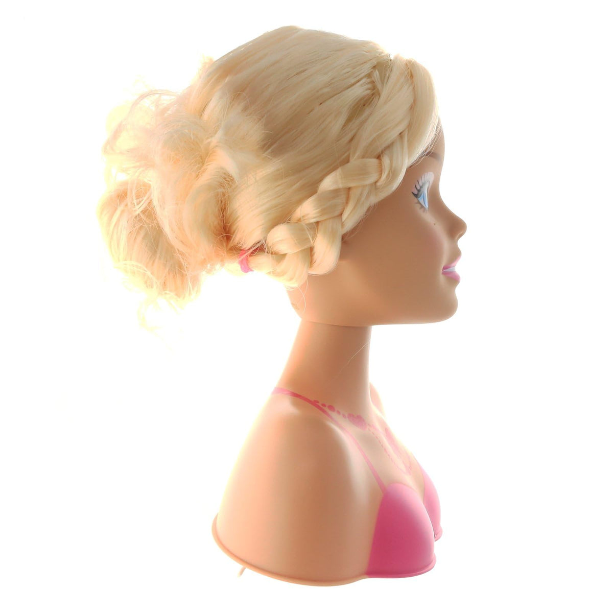 Side view of a blonde styling head with a braided crown and messy bun