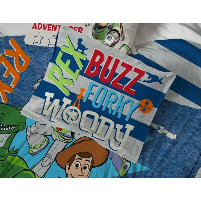 Bed with a blue Toy Story comforter of Woody, Buzz, Rex and Forky