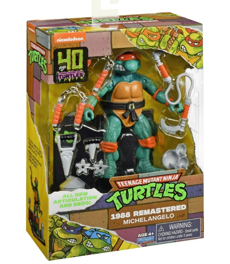 Boxed orange-masked turtle figure with nunchucks and grappling hook
