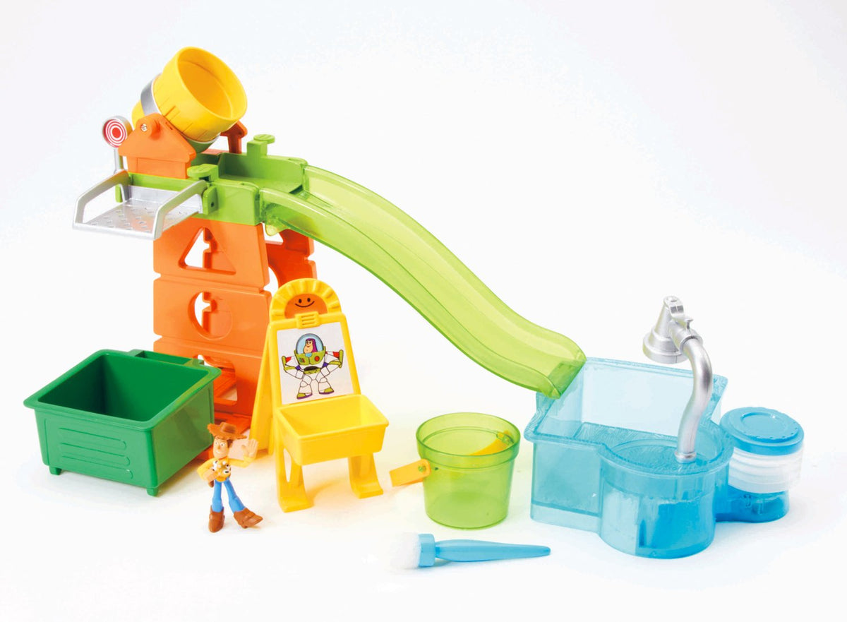 Playground playset with green slide into a blue pool, Buzz easel card and paintbrush