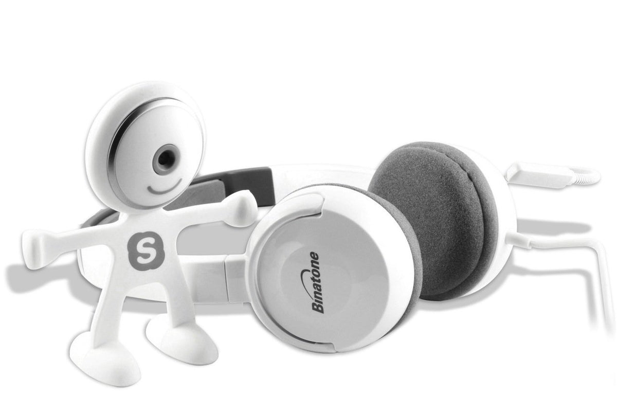White figure-shaped webcam with a round lens head beside white and grey on-ear headphones