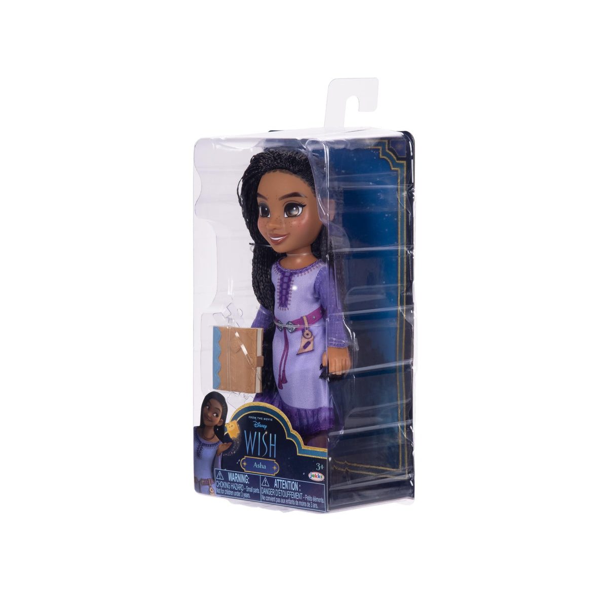 Doll in its clear package seen from the right, holding a small tan book