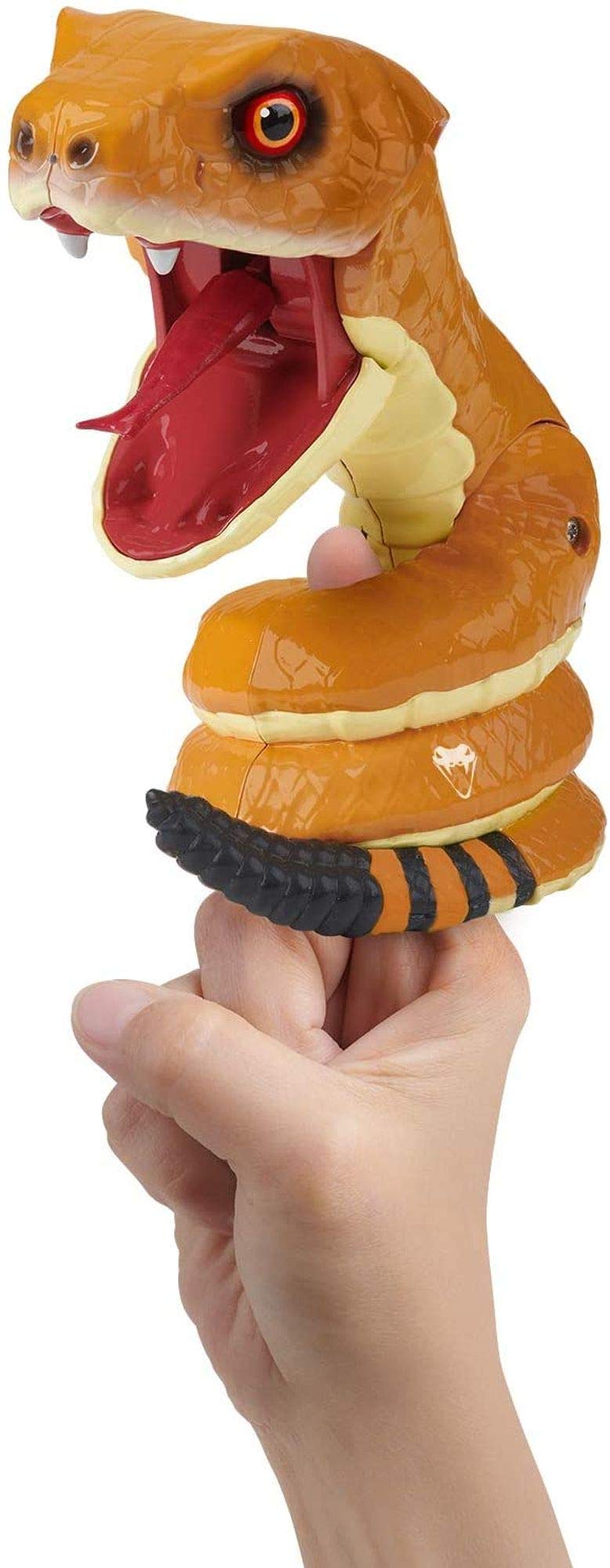 Orange rattlesnake toy coiled around a finger, lunging with its mouth wide open