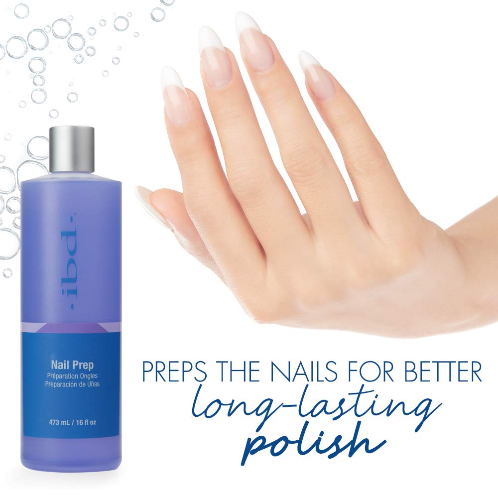 Nail prep bottle beside a hand with long French manicured nails