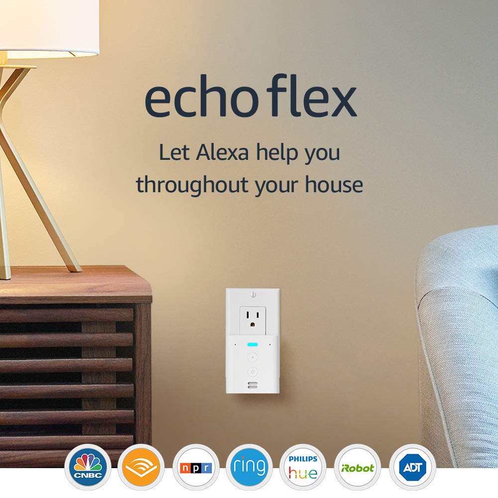 Echo Flex plugged into a wall outlet beside a side table and lamp