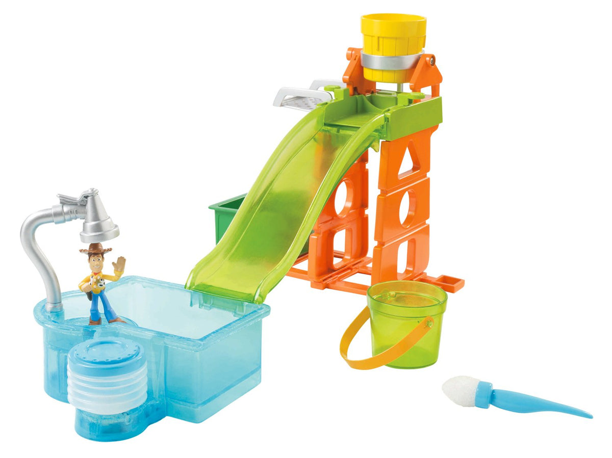 Woody figure under the shower beside the pool, with slide, tower and bucket